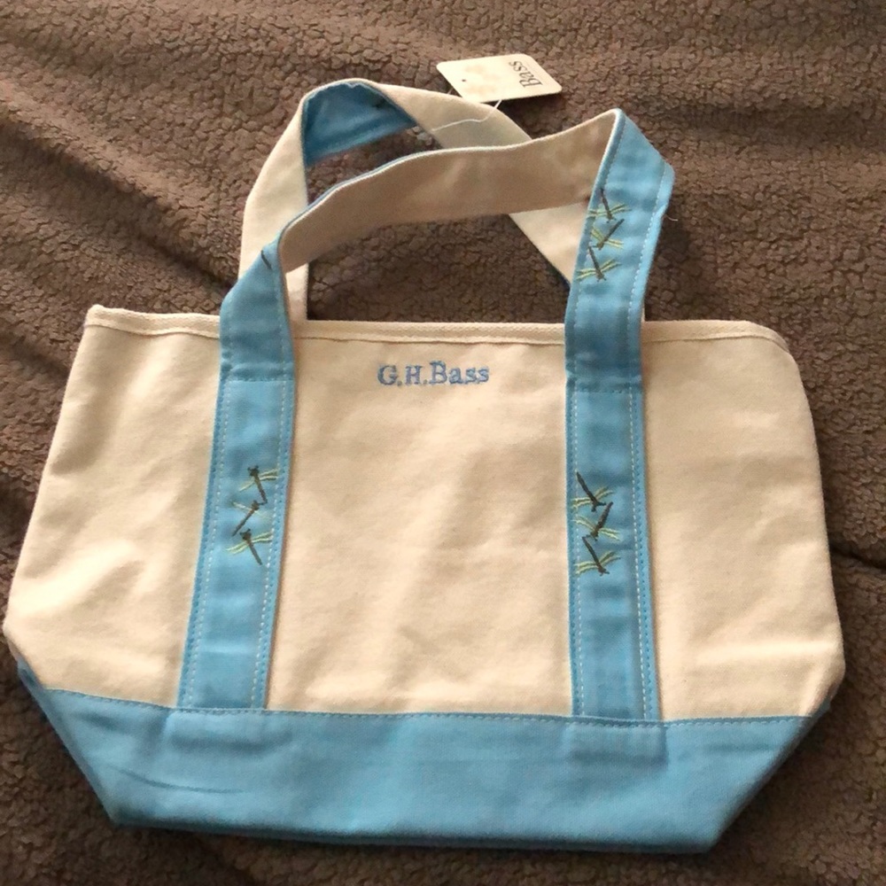 Small canvas tote bass bag with fireflies on it.